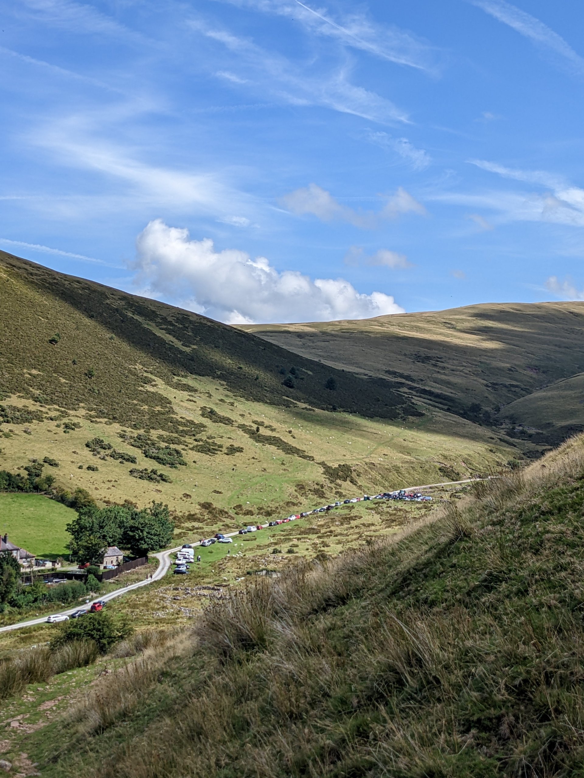 Driver perspective looking through windscreen onto winding mountain pass