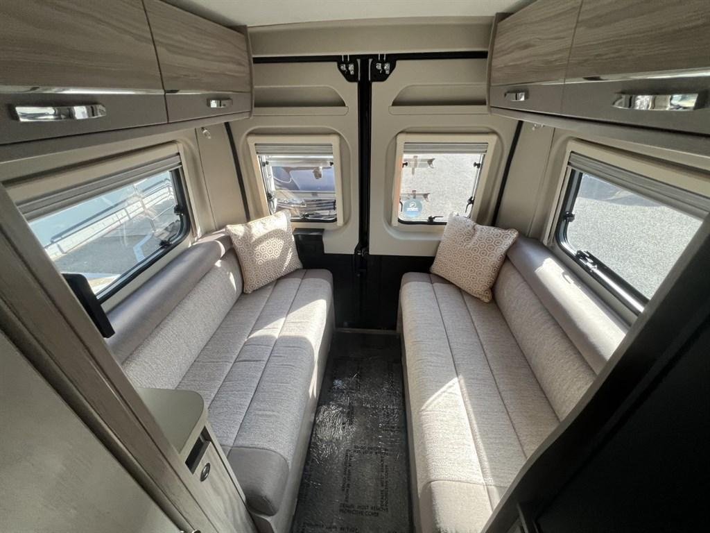 Rear lounge converted into cozy double bed with fitted mattress protector